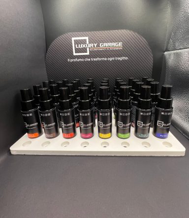 Set of essential oil bottles arranged on a display rack.