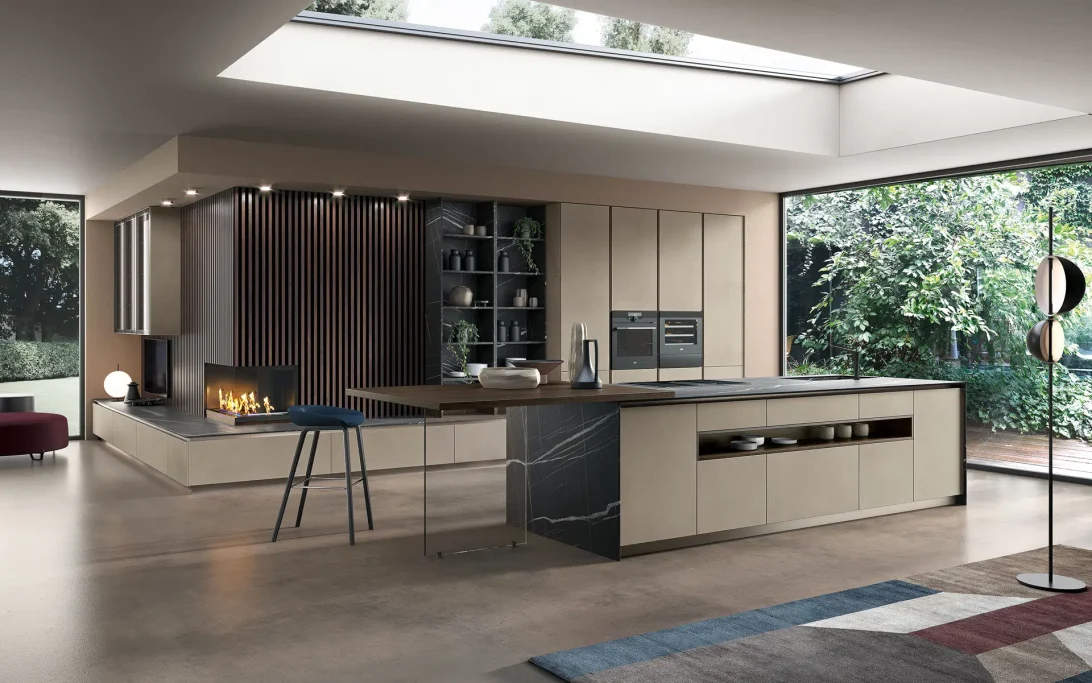 Modern kitchen with an open layout, large windows, and wooden and stone elements.