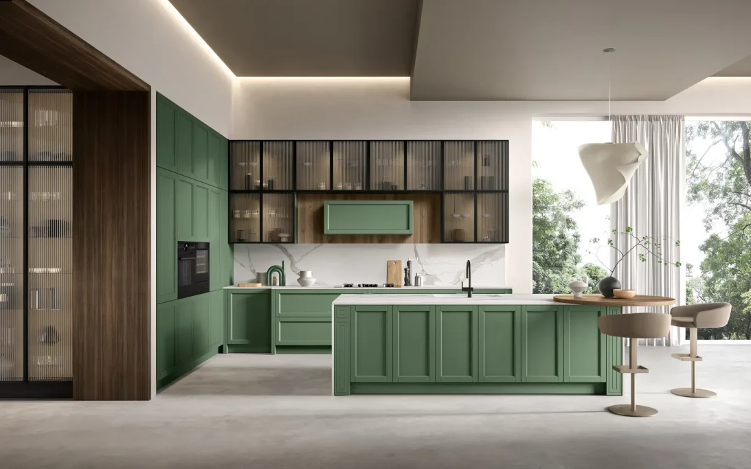 Modern kitchen featuring green cabinetry, a central island, and stylish bar stools.